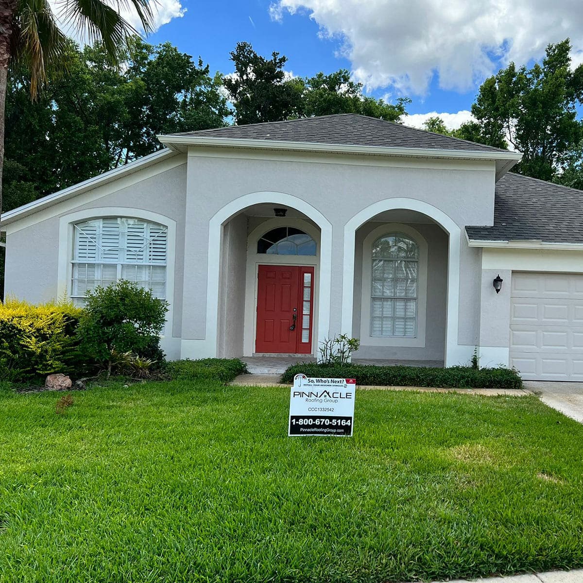 house shingled roof with front lawn Contact Us
